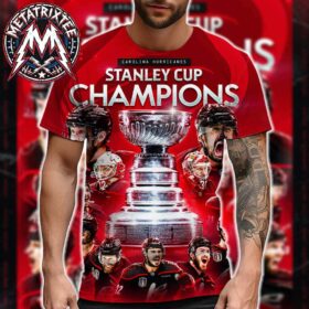 A man with a tattooed arm modeling a red carolina hurricanes 2026 stanley cup shirt featuring players.