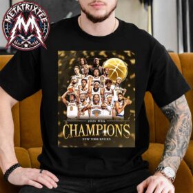 A man sitting down while wearing a black knicks 2026 champions t-shirt with a printed team victory graphic.