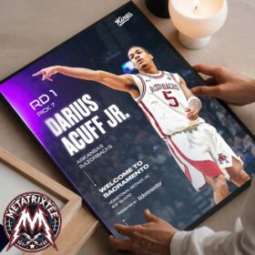 Framed Darius Acuff Jr poster held by hands, showing the player in a jersey with Sacramento Kings draft pick text.