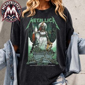 A woman wearing the metallica dublin washed shirt featuring a green skeleton warrior goddess graphic.
