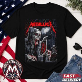 A hooded skeleton graphic with red bat wings printed on a short black metallica glasgow shirt.