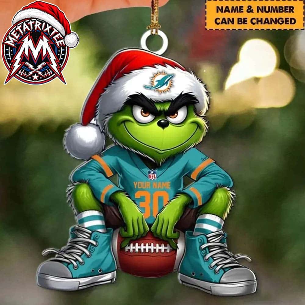 NFL Miami Dolphins Grinch In Santa Hat Sitting On Football Custom Name Number XMAS 2026 Holiday Ornament NFL Miami Dolphins Grinch In Santa Hat Sitting On Football Custom Name Number XMAS 2026 Holiday Ornament